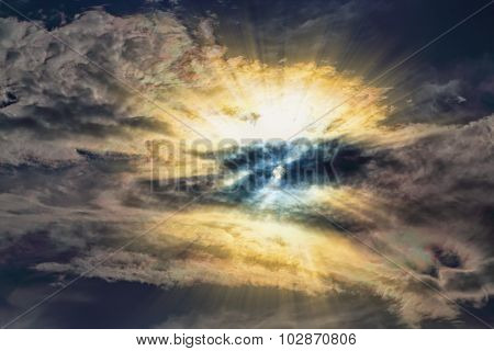 Setting Sun Cuts Through The Thick Clouds Colorful