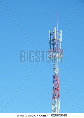 Telecommunication Tower Red And White With Blue Sky Background
