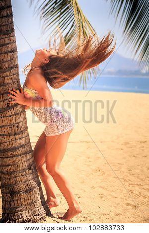 Blonde Girl In Lace Touches Palm Wind Lifts Long Hair Upwards