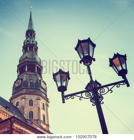 Saint Peters Church In Old City Riga, Latvia. Retro Styled Photo.