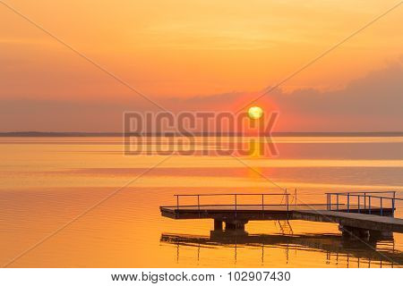 Sunset over water lake coast water summer landscape pier