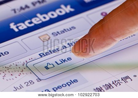 Macro image of clicking the Like button in facebook