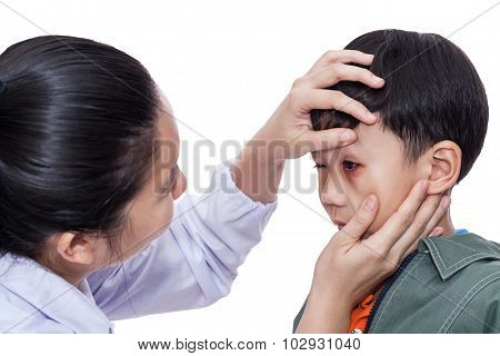 Boy With An Injured Eye. Doctor Examining And First Aid A Patient. White Background