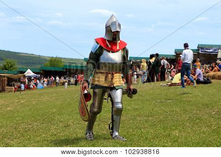 Vatra, Moldova. June 28, 2015. Medieval Festival. Unknown Participant In The Armor Of A Medieval Kni