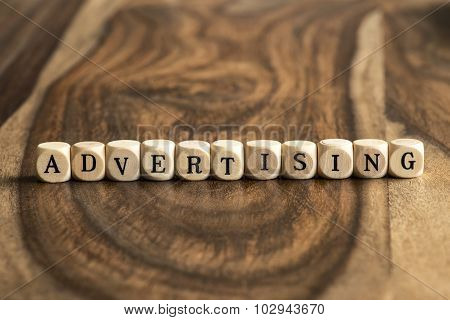 Word Advertising On Wooden Cubes