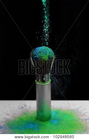 Makeup brush with holi paint
