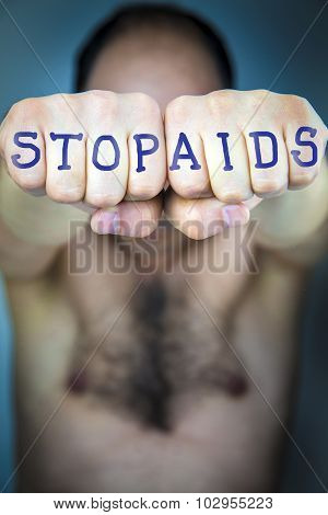 Stop Aids Written On The Fists Of A Man