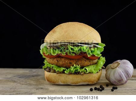 Burger On Wooden Board