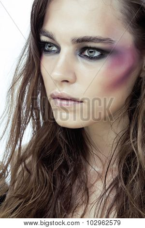 young beauty woman with makeup like shiner on face close up isolated