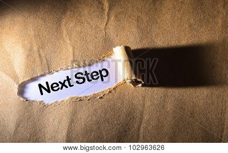 Torn Paper With Word Next Steps
