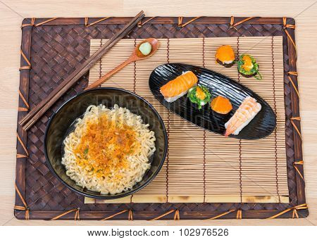 Sushi And Noodle In Black Dish