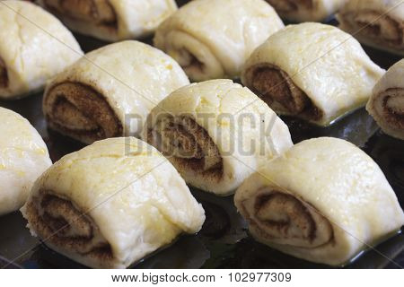 Raw fashioned bun dough with cinnamon