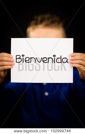 Child Holding Sign With Spanish Word Bienvenida - Welcome