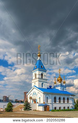 Russian Orthodox church with golden domes on sunny day