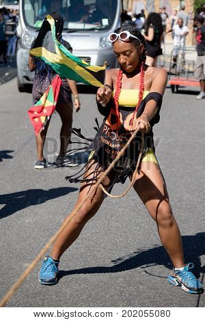 London United Kingdom - August 27 2017. Notting Hill Carnival one of the largest street parties in Europe is now in its 51st year. This year was close to the ruin of Grenfell Tower scene of a devastaing fire.