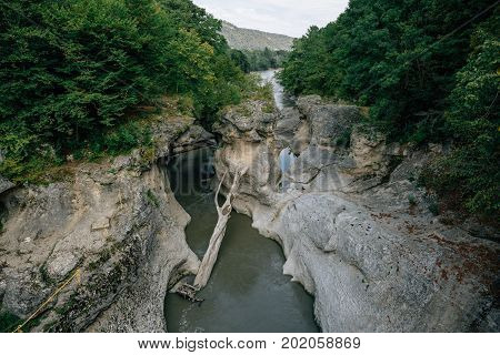 Aerial panoramic view of Beautiful natural mountain canyon with a mountain river and forest, idilic tranquil hipster lndscape