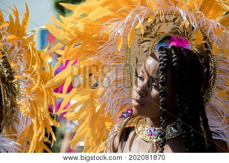 London United Kingdom - August 27 2017. Notting Hill Carnival one of the largest street parties in Europe is now in its 51st year. This year was close to the ruin of Grenfell Tower scene of a devastaing fire.