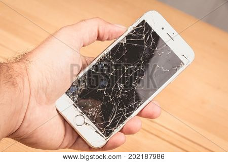 A Man Holds In His Hand An Iphone 6S Of Apple Inc