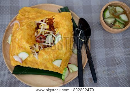 Vietnamese stuffed crispy egg omelet crispy crepe topped fried shrimp minced pork in coconut stir with herb and tofu filling in Thai call Kanom Buang Yuan or banh xeo