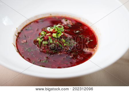 Beetroot soup with meat and sourcream served in restaurant
