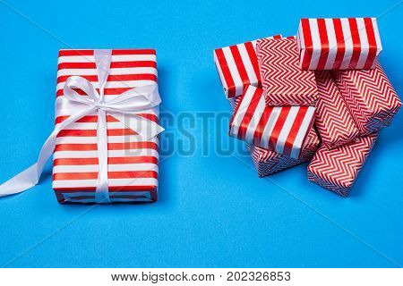 Hill red and white gifts on the blue background