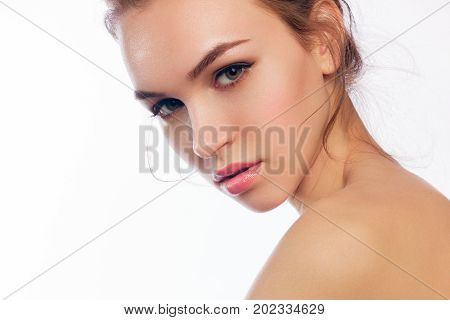 beautiful model lady with natural make-up and blonde hair studio fashion shot on white background perfect skin