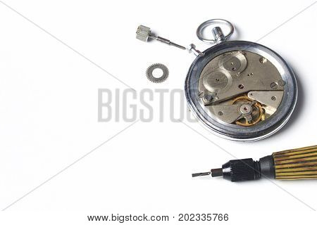 The Watch Workshop. Repair Of Old Watches. The Mechanism Of The Clock, The Screwdriver, Which The Ma