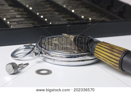 The Watch Workshop. Repair Of Old Watches. The Mechanism Of The Clock, The Screwdriver, Which The Ma