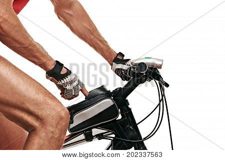 male sportsman clicks on a smartphone in a bag of modern bike. white background