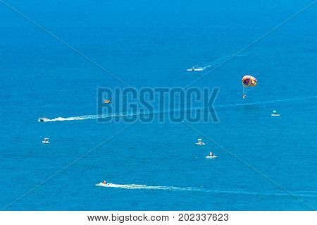 Parasailing towed by craft in the sea