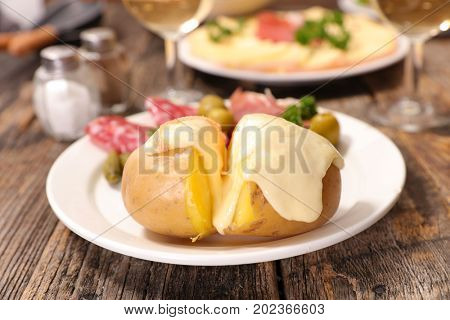 raclette cheese melting on potato