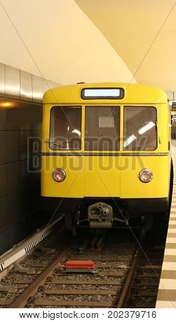Yellow Metro Car Stationed At The Underground Train Station
