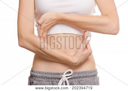 Female hands belly circling stomach on white background isolation