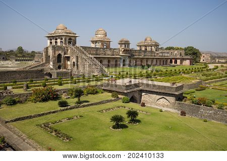 Jahaz Mahal Ship Palace and blue water lake in sunrise. Mandu Madhya Pradesh India