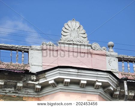 Architectural decor. Architecture.  Fragment of an old building with decor. Architectural background. Pink house. Ust-Kamenogorsk.