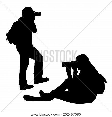 set of vector silhouettes of sitting and standing photographer with telephoto isolated on white background