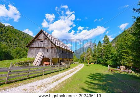 Mountain farm house, hut in European Alps, located in Robanov kot, Slovenia, popular hiking and climbing place with picturescue view