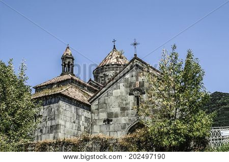 View of the crosses of the round dome of the temple of Gregory the Illuminator on the three-nave bell and the gavit of St. Nshan