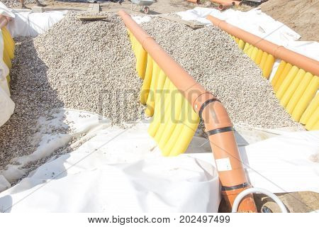 Building a ground heat exchanger to heat up the air in winter and cool down in summer