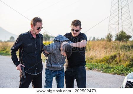 Arresting A Thief, A Criminal, A Drug Dealer With Hands Armed With Police Cuffs, A Thief Disabled, T