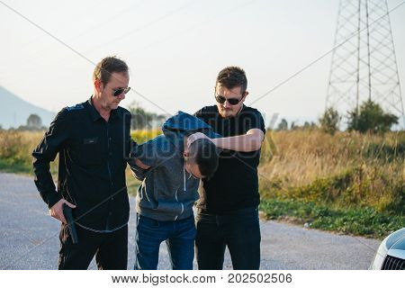 Arresting A Thief, A Criminal, A Drug Dealer With Hands Armed With Police Cuffs, A Thief Disabled, T