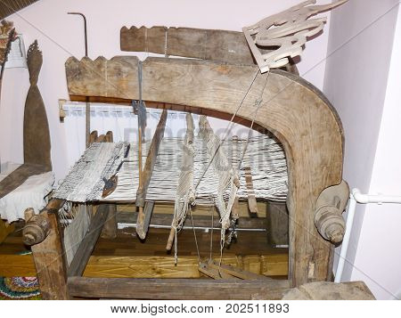 Ancient wooden a loom. Ancient textile equipment
