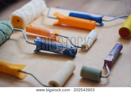 Set of instruments for making repair on wooden background in details