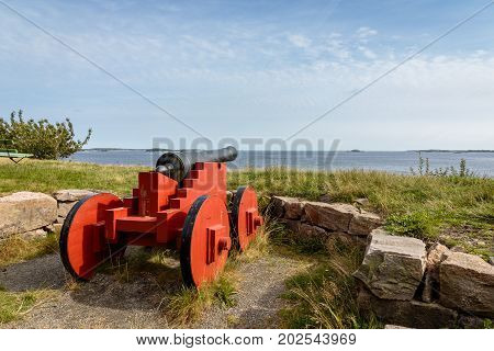 Cannons standing on Odderoya, Kristiansand, Norway. Used to defend Kristiansand. View to the sea, blue sky