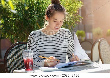 Closeup Picture Of Young Beautiful European Woman Dressed Casually Without Makeup Sitting At Table I