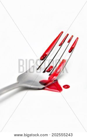 fork with blood on a white background