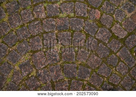 the sidewalk of old stones in the fortress texture