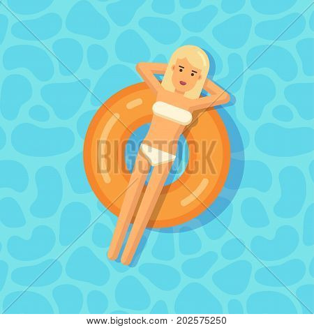 Young girl floating on an inflatable circle in a swimming pool