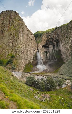 A large Caucasian waterfall in the tract of Jylysu flowing into the Malka River