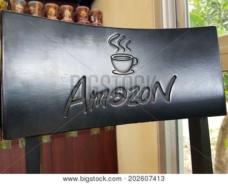 Pathum Thani THAILAND - Sep 32017 : Close up a Amazon logo screened on the chair at Cafe Amazon coffee shop. It's a famous Thai franchise coffee house in Thailand.